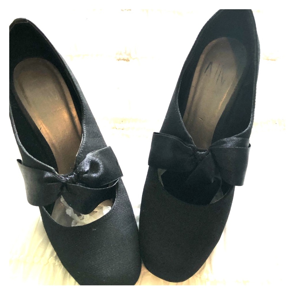 Black silk bow pumps